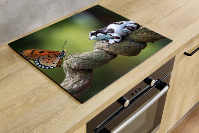 Herdabdeckplatte - Schmetterling und Frosch