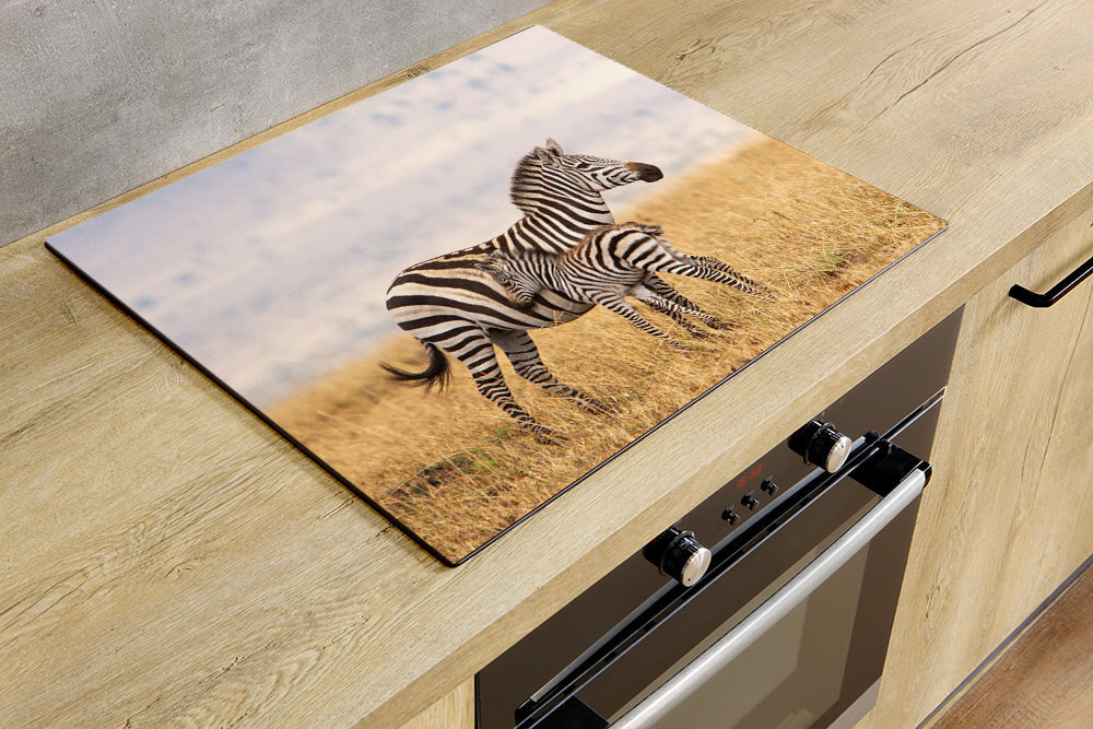 Herdabdeckplatte - Zebra in einem Rasen