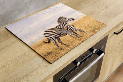 Herdabdeckplatte - Zebra in einem Rasen
