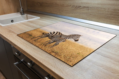 Herdabdeckplatte - Zebra in einem Rasen